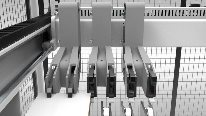 Le pinze massivamente costruite sono montate su guide lineari e controllate in modo intelligente.